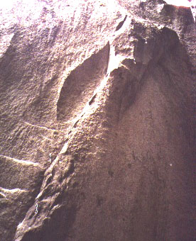 A view of Permanent Waves (5.13c) on the Kacodemon boulder