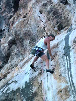John finishing the first crux on Unsuspecting Remora, 5.11d/12a