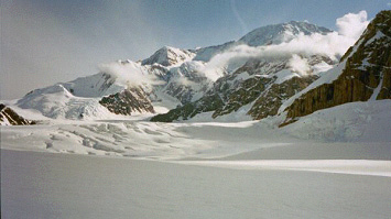 Looking up the Kahiltna glacier from near the landing strip towards Denali.  The West Buttress route roughly follows the long ridge descending from the summit to the left edge of the photo.