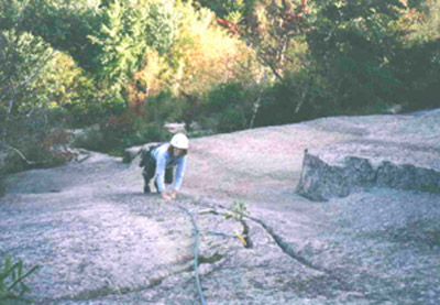The delicate crux moves on the smooth face of the direct second pitch