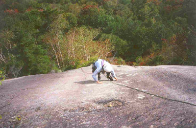 Dawn coming up the friction runout.  The tree island is directly below her.