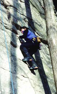 Julie Haas trys out her new <br>boots on Rhododendron (5.6)