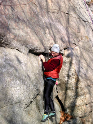 Mike bouldering on Pas de Deux Direct (5.10)