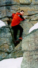 Todd bouldering in the snow