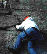 Tom bouldering the start of Easy O (5.2)