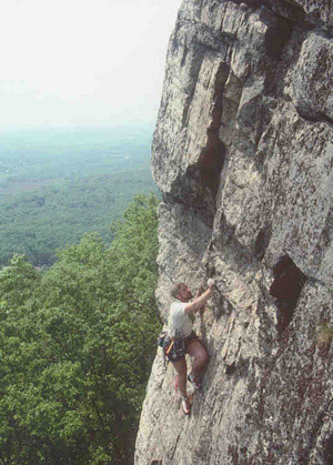 A stranger starting the crux of Grand Central (5.9-).  Photo courtesy Mike Rawdon
