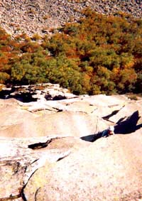 Dawn heading towards the sickle on Moby Grape (5.8) at Cannon