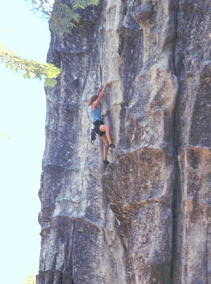 Through the crux on Surrealistic Direct, 5.10a